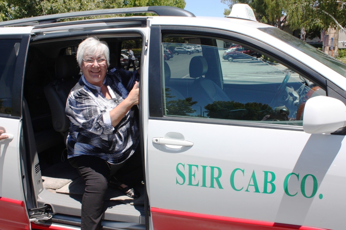 Taxi Service participant getting in the taxi. 