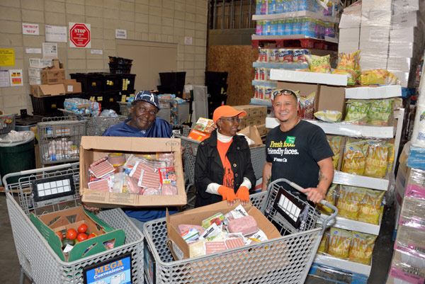 Food recovery warehouse with people and food donations