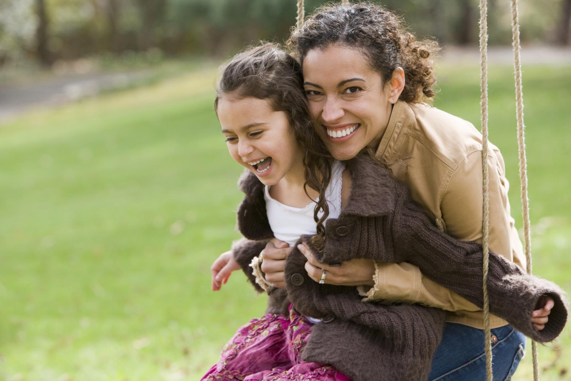 mom and daugher on swing