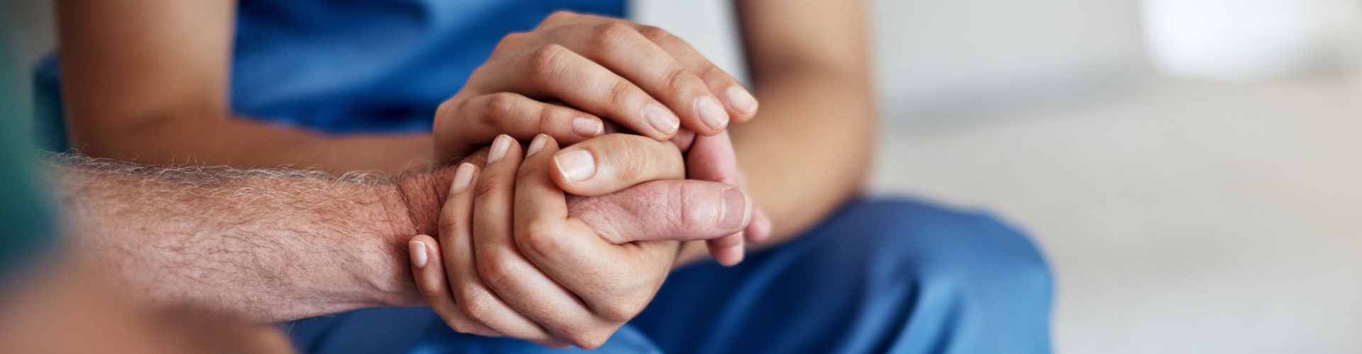 Two people holding hands