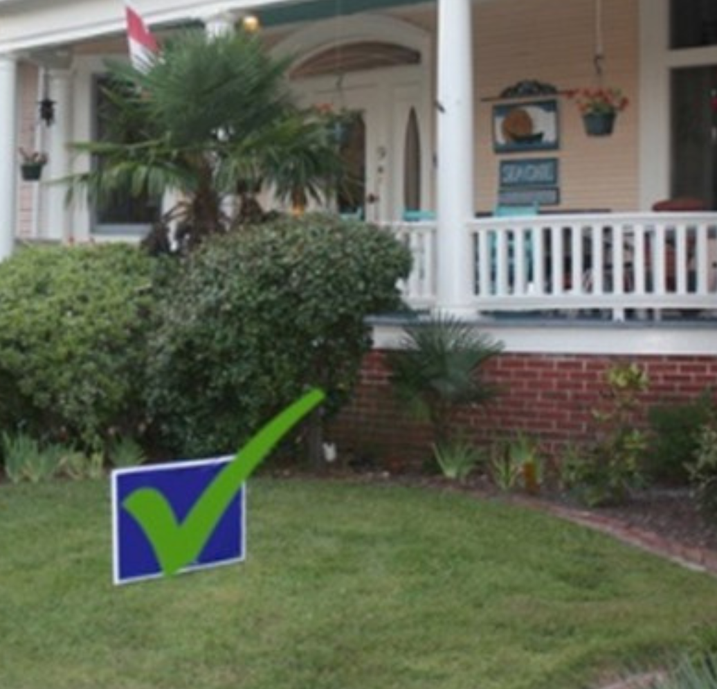 House with campaign signs in front yard