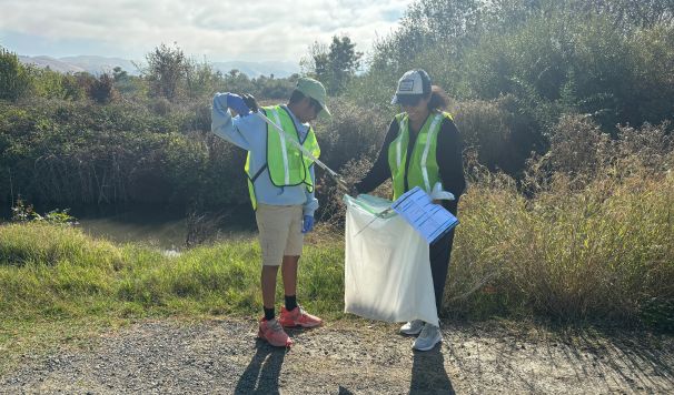 Two kids with Litter Pickers