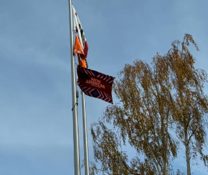 Native American Heritage Month Flag on flagpole with two flags above it